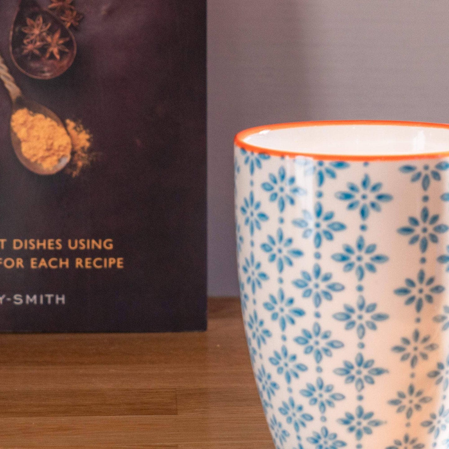 Blue pattern mug with orange trim