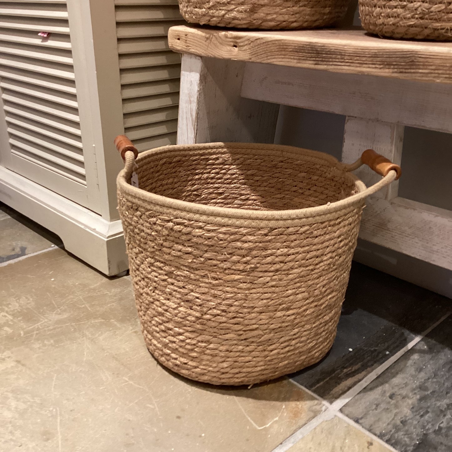 Woven basket with wooden handles