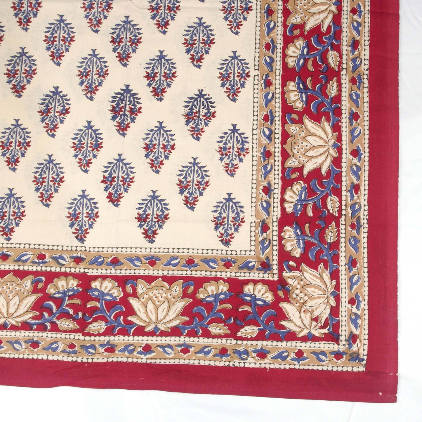 Red and cream tablecloth with blue motif
