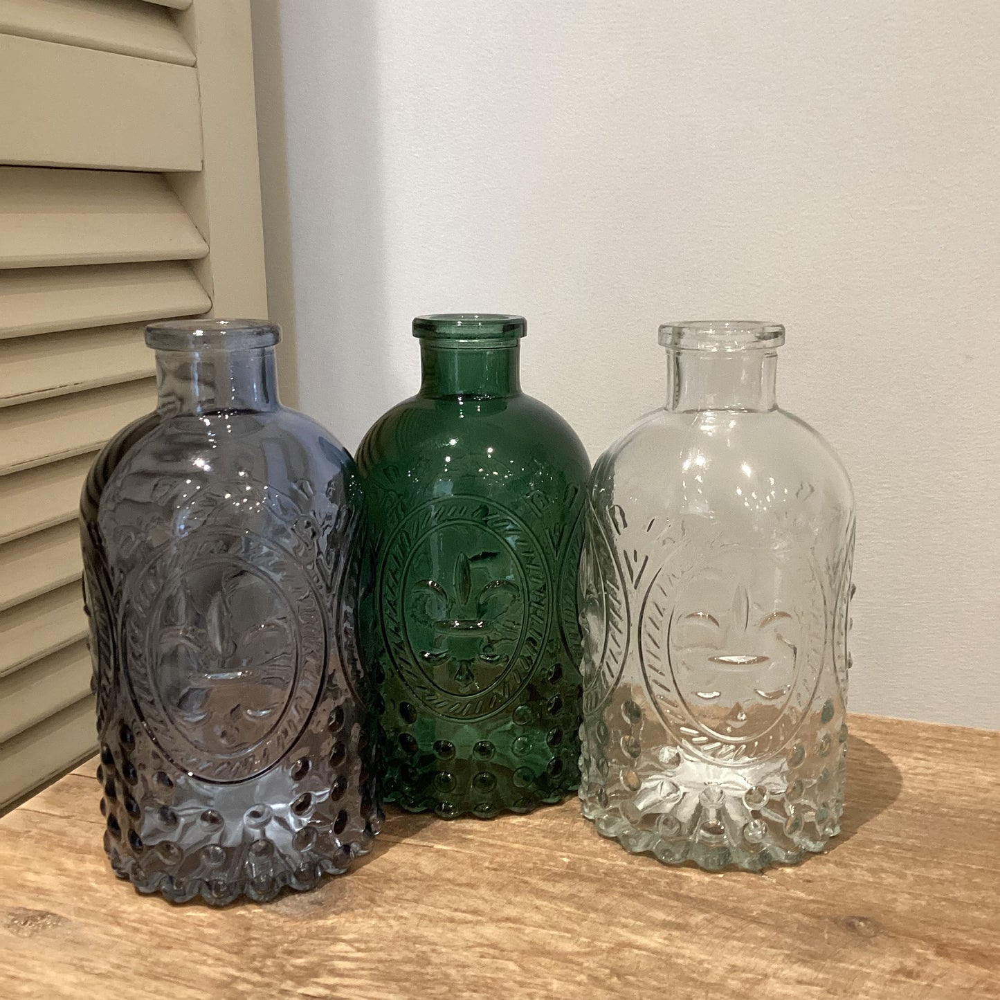 Fleur de Lis glass bottle in green