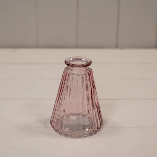 Pink coloured ribbed glass cone bottle