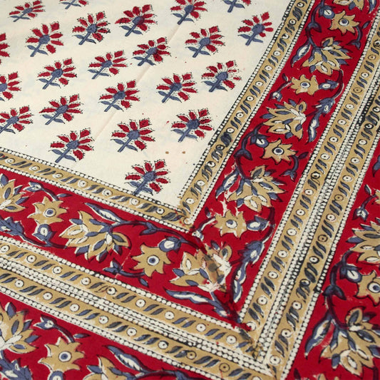 Red and cream tablecloth with red motif