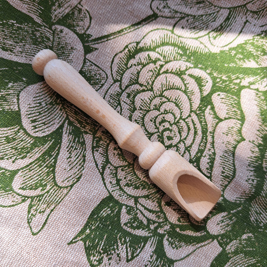 Wooden scoop with turned handle