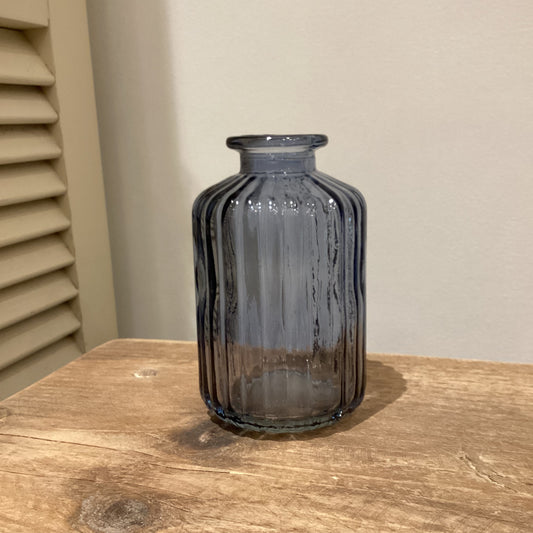 Small ribbed glass bottle in blue