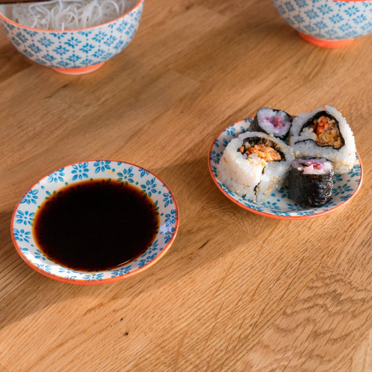 Blue Flower with orange trim dipping saucer