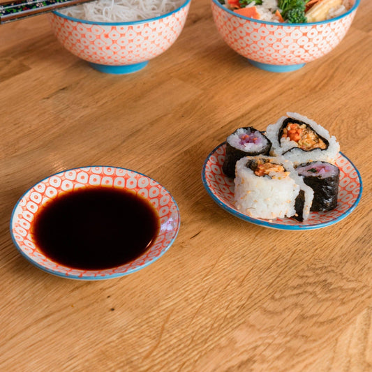 Orange and blue trim dipping saucer