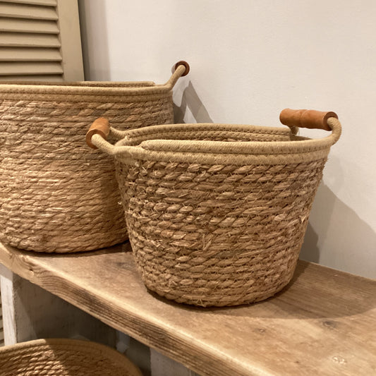 Woven basket with wooden handles