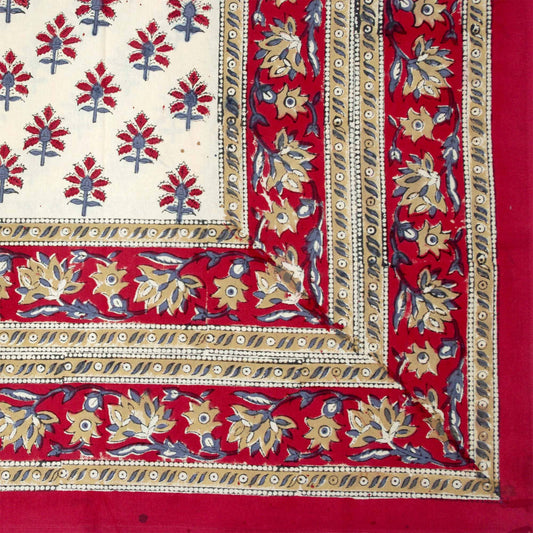Red and cream tablecloth with red motif
