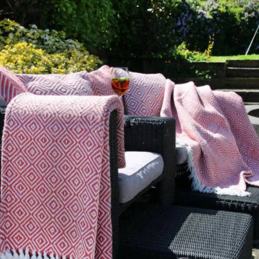 Woven diamond throw in coral pink