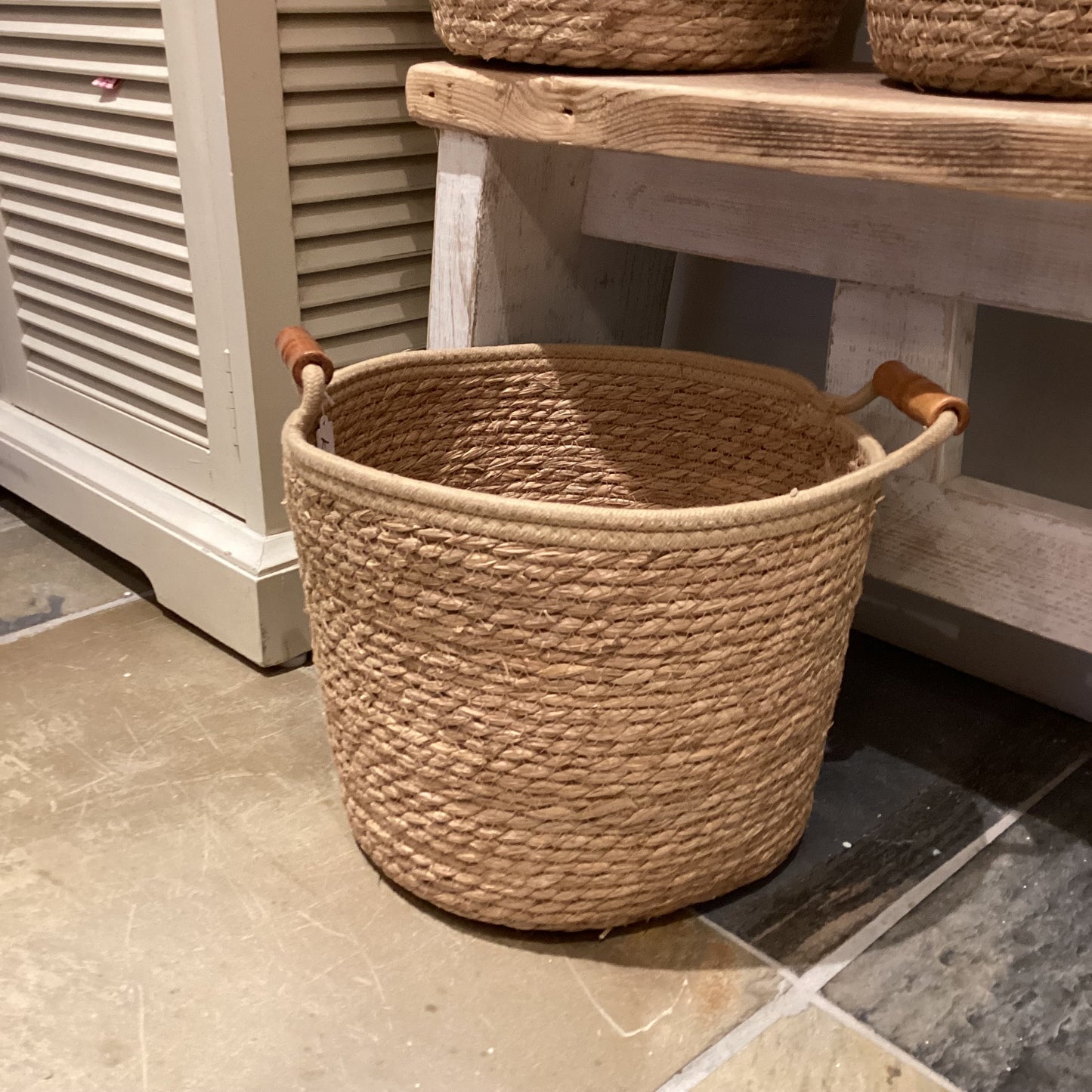 Woven basket with wooden handles