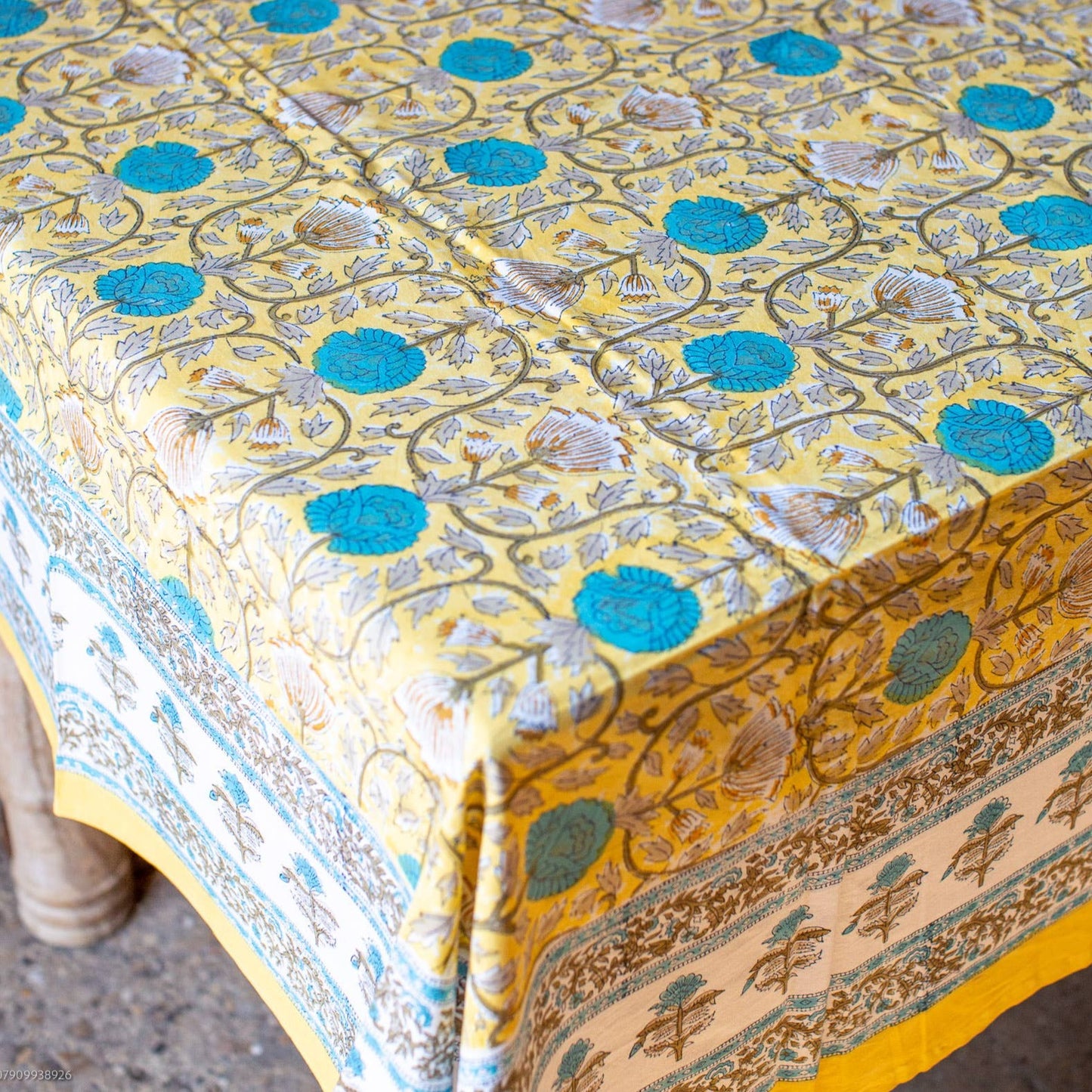 Turquoise and yellow tablecloth