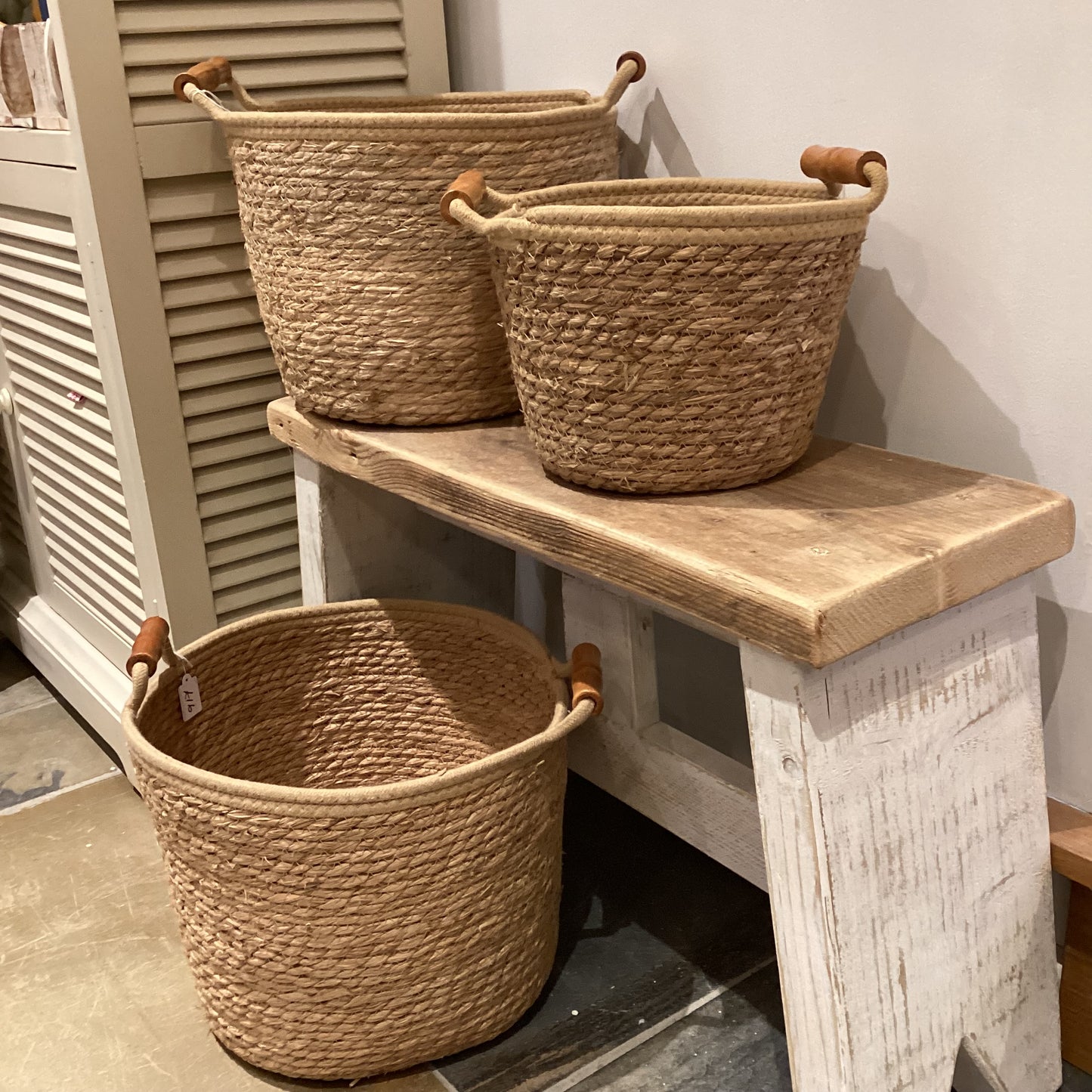 Woven basket with wooden handles