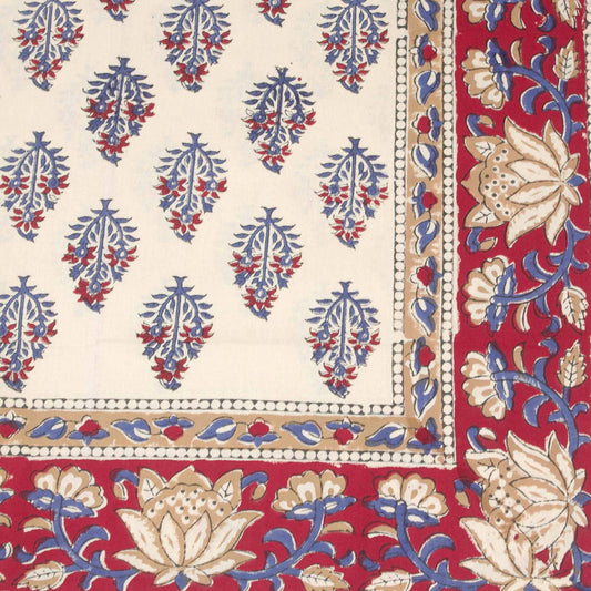 Red and cream tablecloth with blue motif